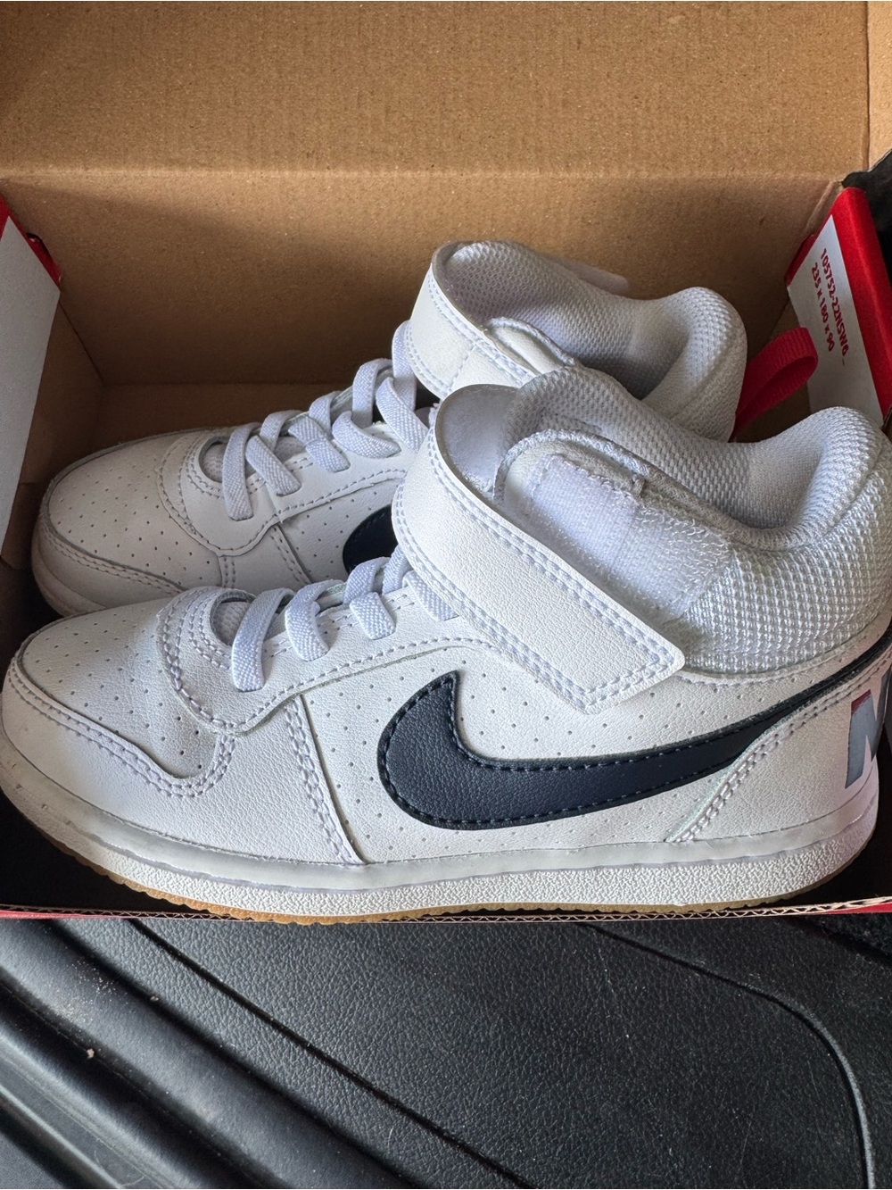 Nike Kids White High-Top Sneakers with navy Swoosh and Red Heel Tab